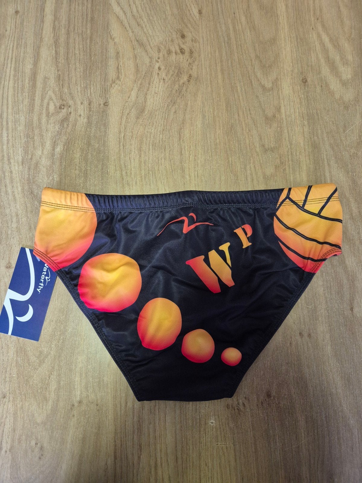 Waterfly Waterpolozwembroek - Zwart met oranje/gele print, Ophalen of Verzenden, Zwart, Waterfly, Zwemslip