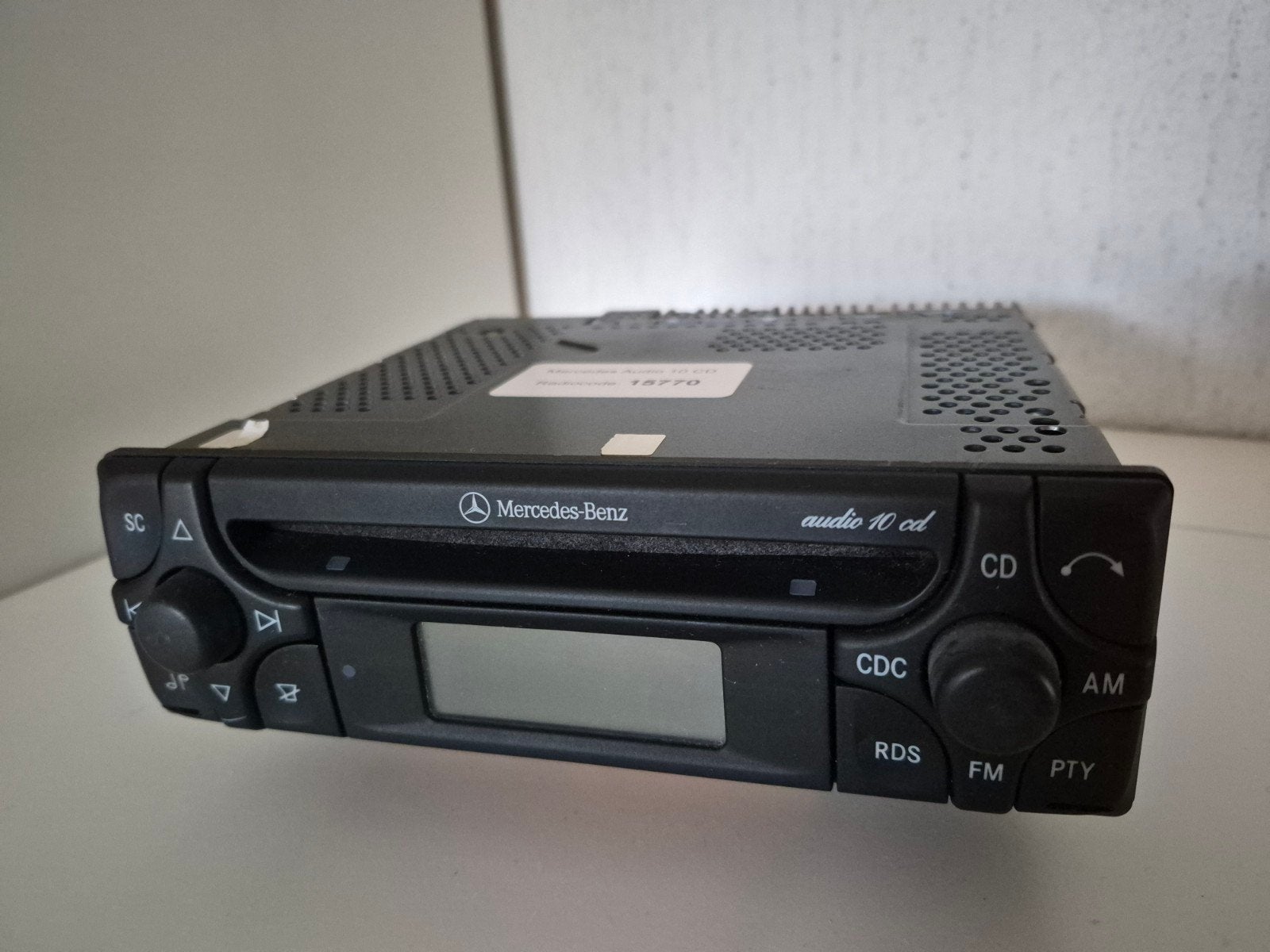 Mercedes Audio 10 CD Autoradio met code, Auto diversen, Ophalen of Verzenden, Gebruikt
