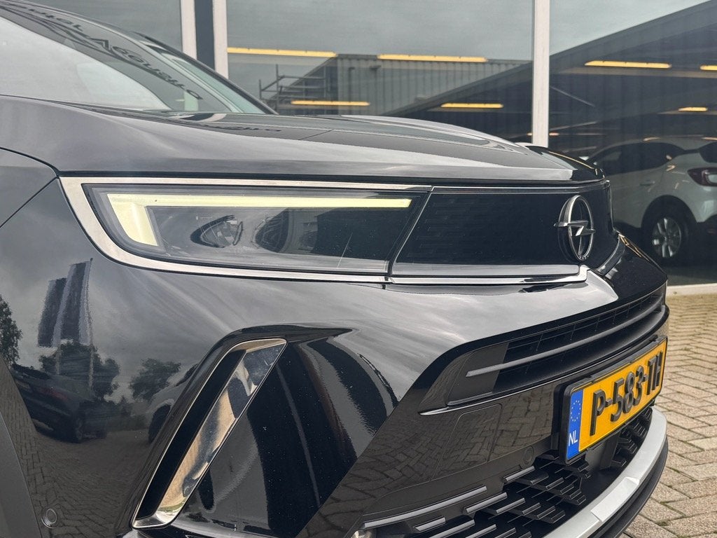 Opel Mokka 1.2 Turbo BUSINESS ELEGANCE | LEER | CAMERA |TREK, Auto's, Voorwielaandrijving, 1199 cc, 620 kg, Zwart