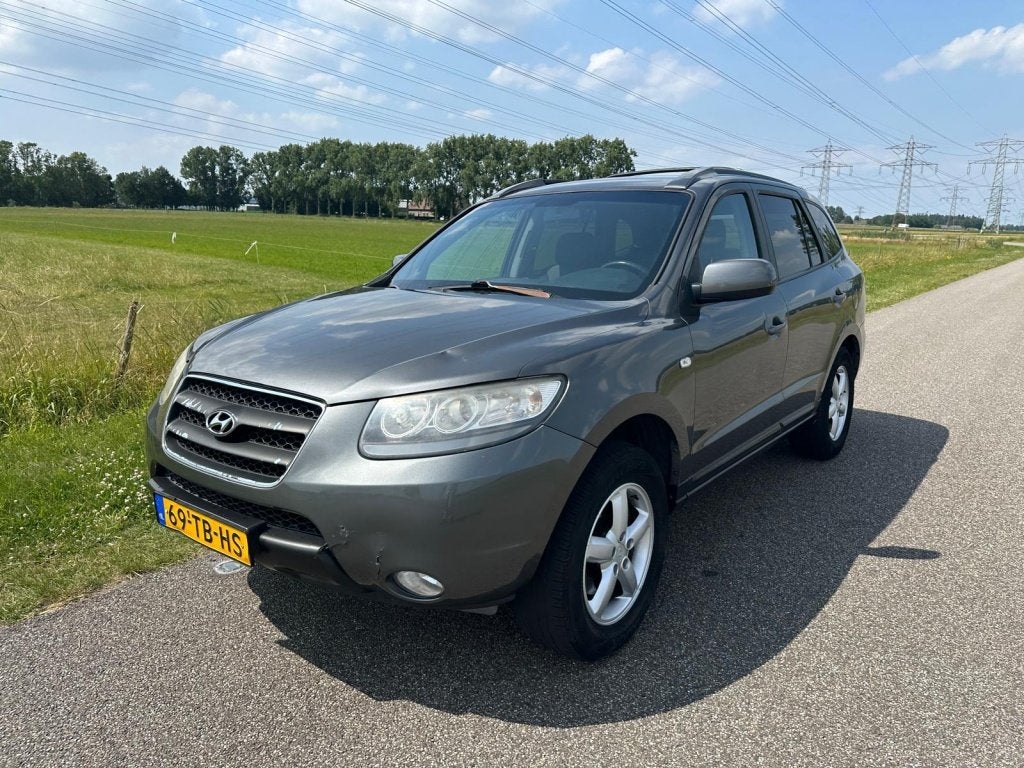 Hyundai Santa Fe 2.7i V6 Dynamic 7p. (bj 2006), Auto's, Automatische klimaatregeling, Santa Fe, 2000 kg, Bedrijf