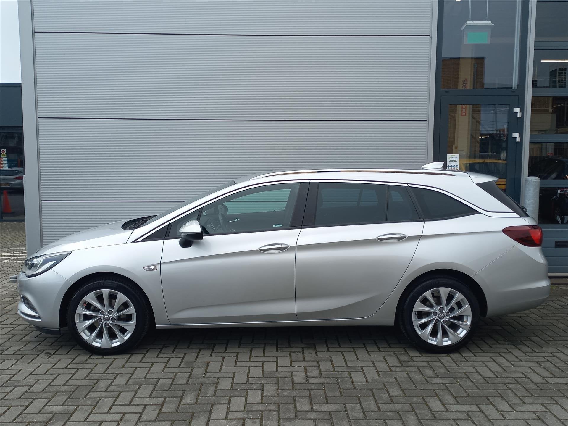 Opel Astra Sports Tourer 1.4T 150pk Business+ | Climate cont, Voorwielaandrijving, Stof, Gebruikt, 4 cilinders
