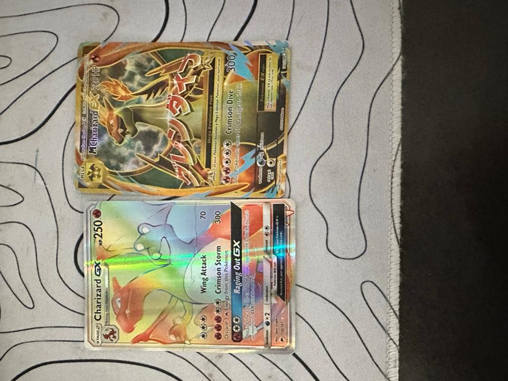 Charizard GX & M Charizard EX Pokémon kaarten - Beschadigd, Ophalen, Gebruikt, Meerdere kaarten, Foil