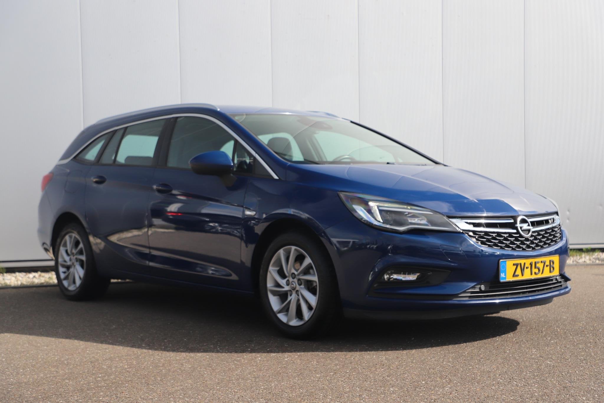 Opel Astra Sports Tourer 1.0 Turbo Business Executive 105PK, Stof, Gebruikt, 1178 kg, Met garantie (alle)