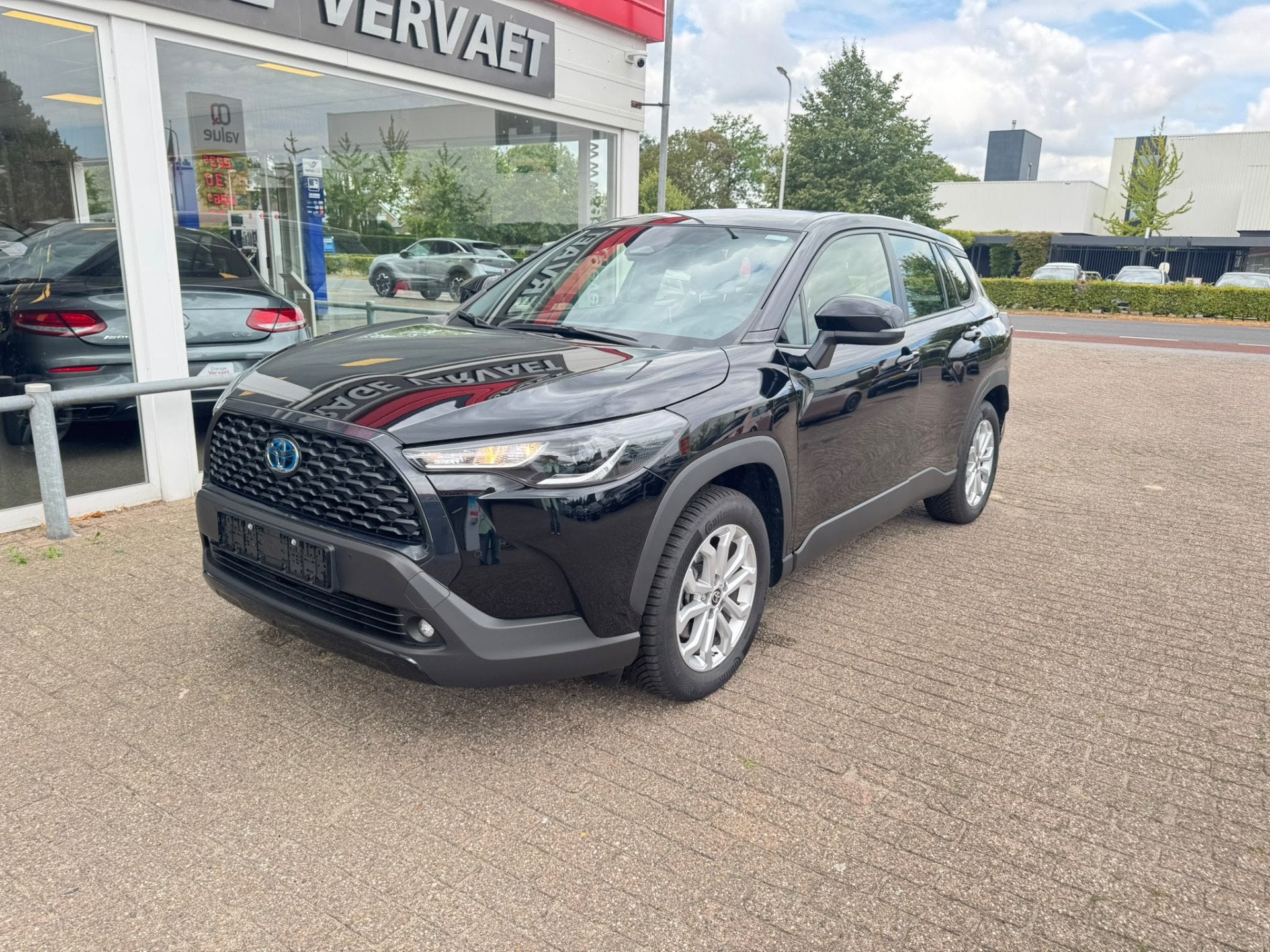 Toyota Corolla Cross 2.0 High Power Hybrid Active (bj 2023), Stof, 4 cilinders, Automatische klimaatregeling, Zwart