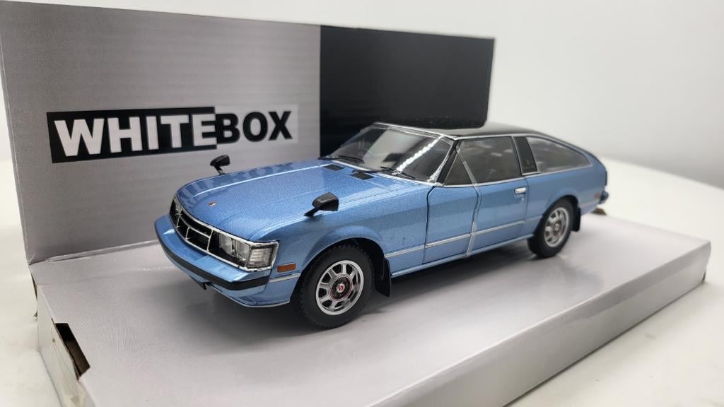 Toyota Celica XX 1978 Lichtblauw/Zwart van WhiteBox, Hobby en Vrije tijd, Modelauto's | 1:24, Ophalen of Verzenden, Nieuw, Auto