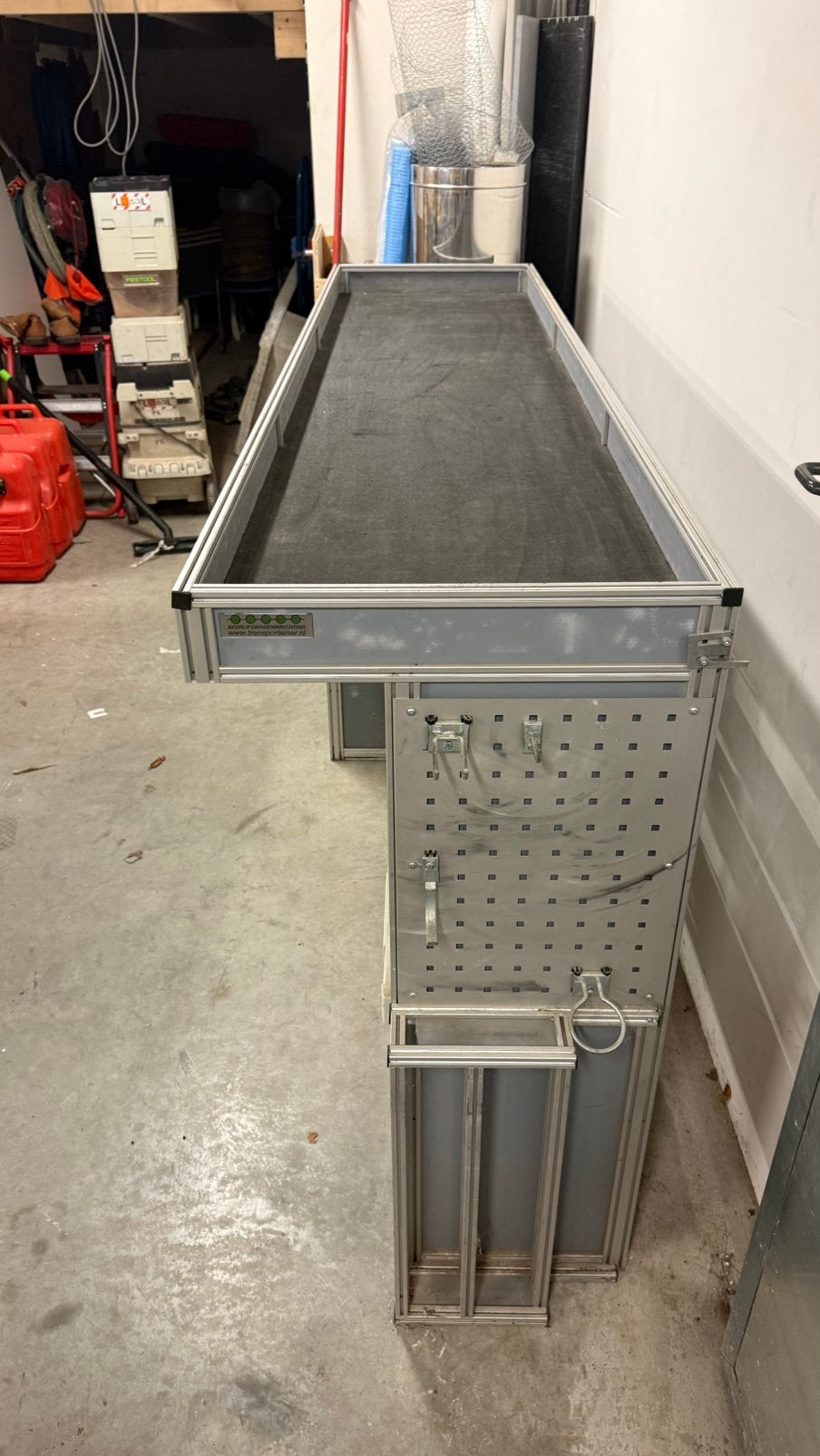 Bedrijfswageninrichting Transportainer, Ophalen