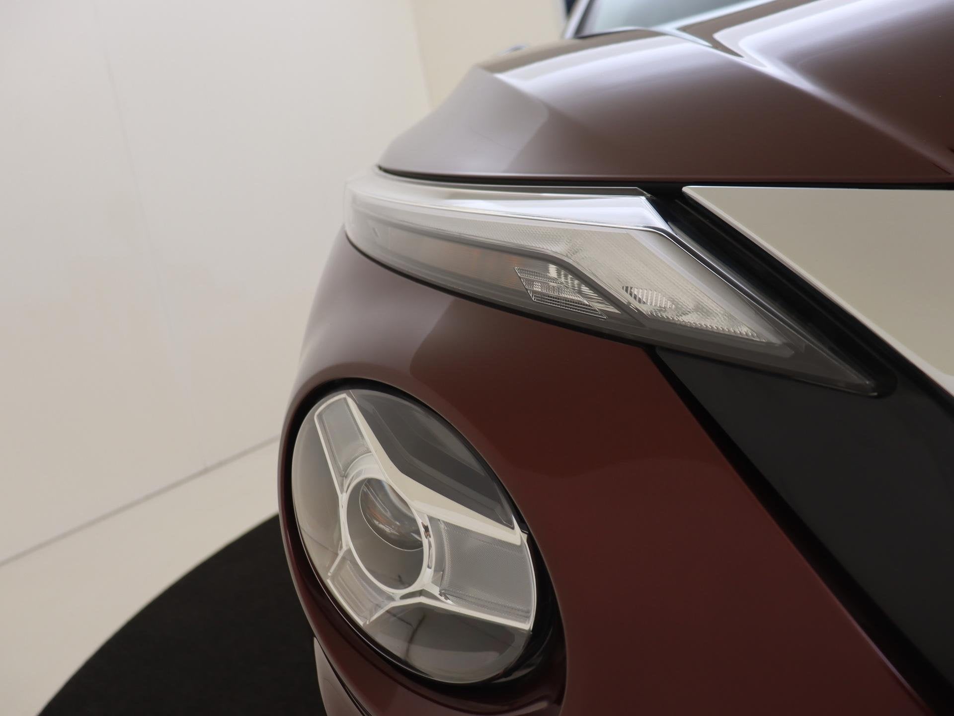 Foto 10 van Nissan Juke 1.0 DIG-T Acenta | Achteruitrijcamera | Wieldopp