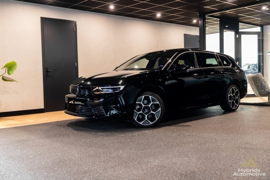Opel Astra Sports Tourer 1.6 T PHEV Ultimate | Pano | Leder, Auto's, Gebruikt, Zwart, 4 cilinders, Zwart