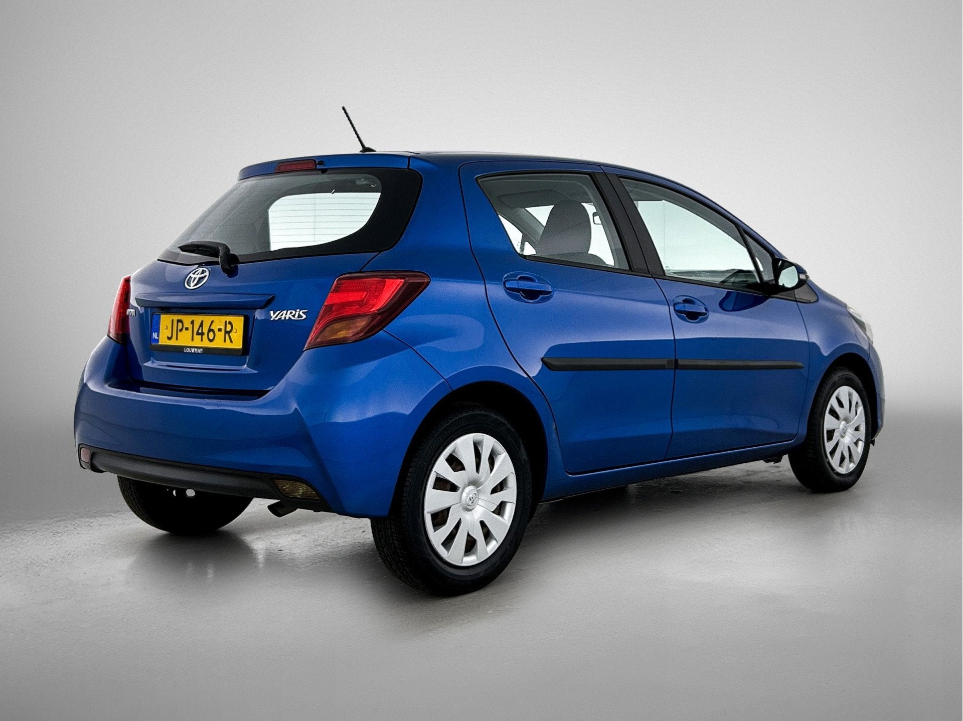 Toyota Yaris 1.3 VVT-i Business Plus Navigatie | 6 bak | Cam, Auto's, Stof, 4 cilinders, Blauw, Bedrijf