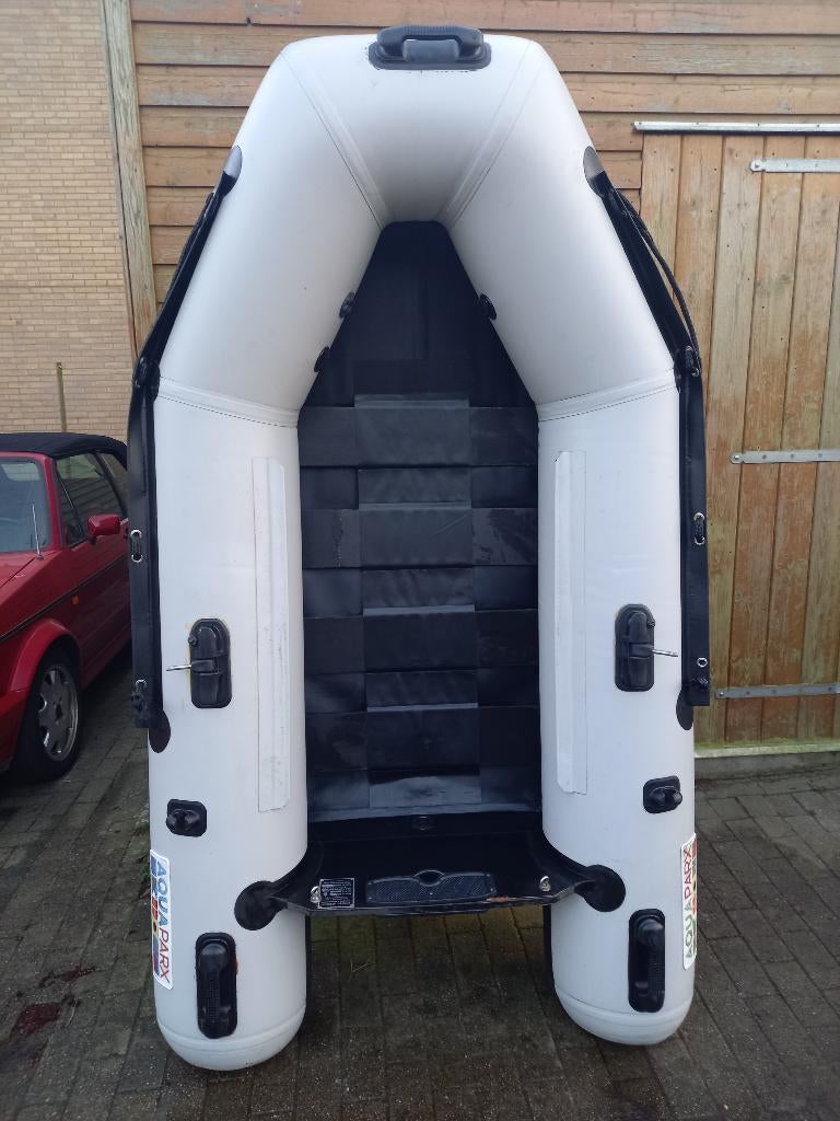 rubberboot met 2.5 motor 4 takt, Watersport en Boten, Rubberboten, Ophalen, Gebruikt, Inclusief motor, Hout