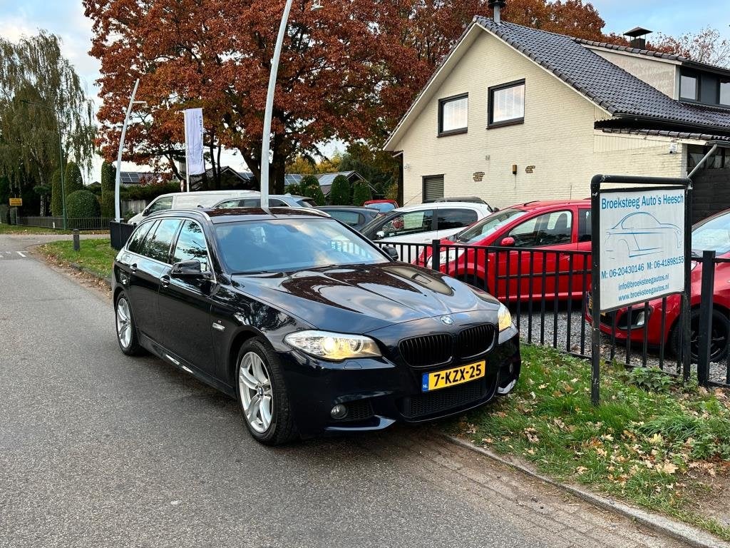 Foto 15 van BMW 5-serie Touring 520i High Executive netteauto/keurigonde