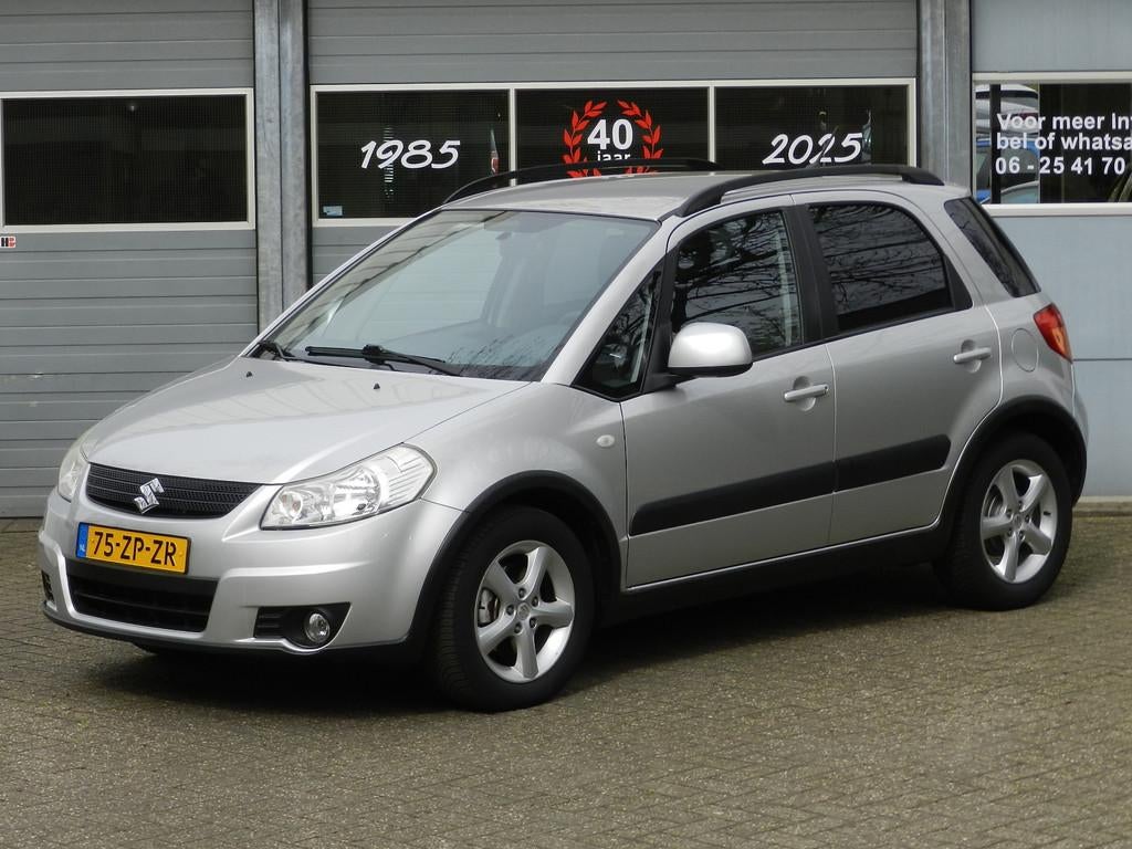 Suzuki SX4 1.6 Shogun Airco 16"LMVCV afst Isofix Metallic la, Gebruikt, Zwart, 4 cilinders, 49 €/maand