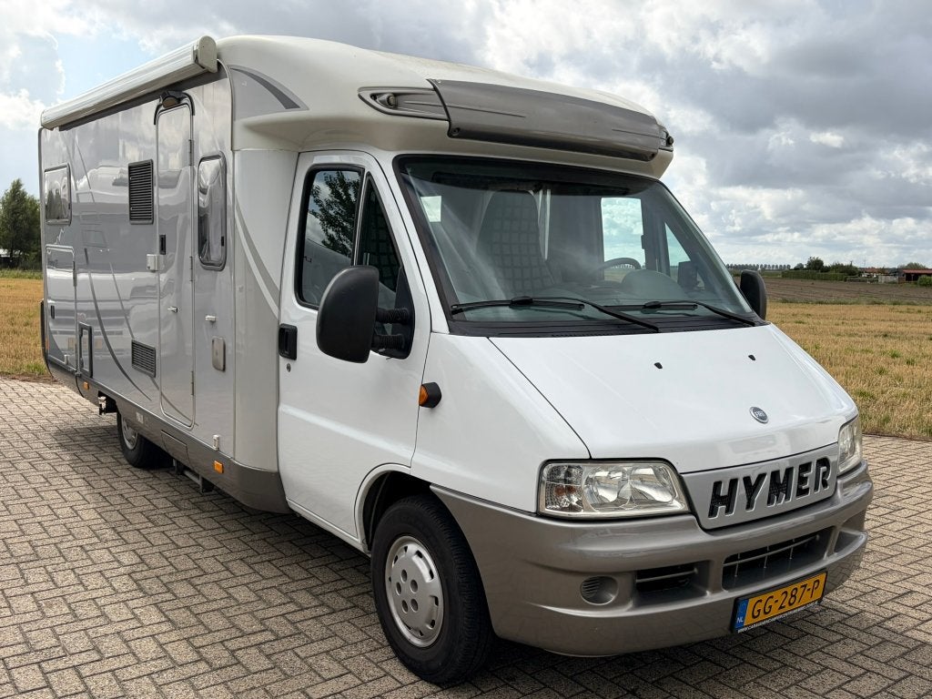 Hymer Tramp T664 GT Motorairco/Luifel/Omvormer/Fietsendrager, Caravans en Kamperen, Koelkast, Standaard zit, Ringverwarming, 6 tot 7 meter