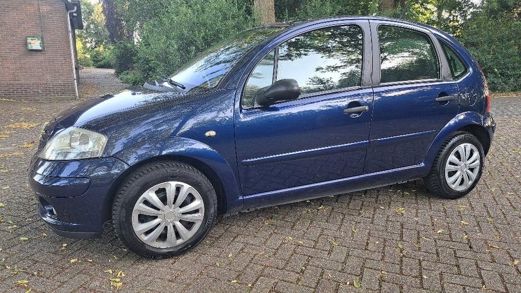 Citroën C3 1.4 Attraction Clima Cruise Velours Nw banden!, Auto's, Voorwielaandrijving, Zwart, 4 cilinders, Blauw