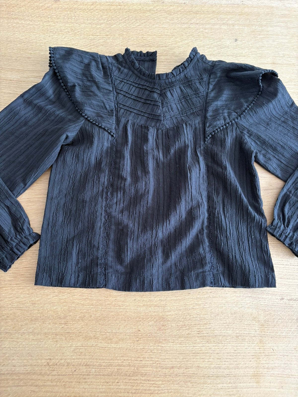 Zwarte longsleeve top van de we, maat 122 / 128, Ophalen of Verzenden, Zo goed als nieuw, Meisje, Shirt of Longsleeve