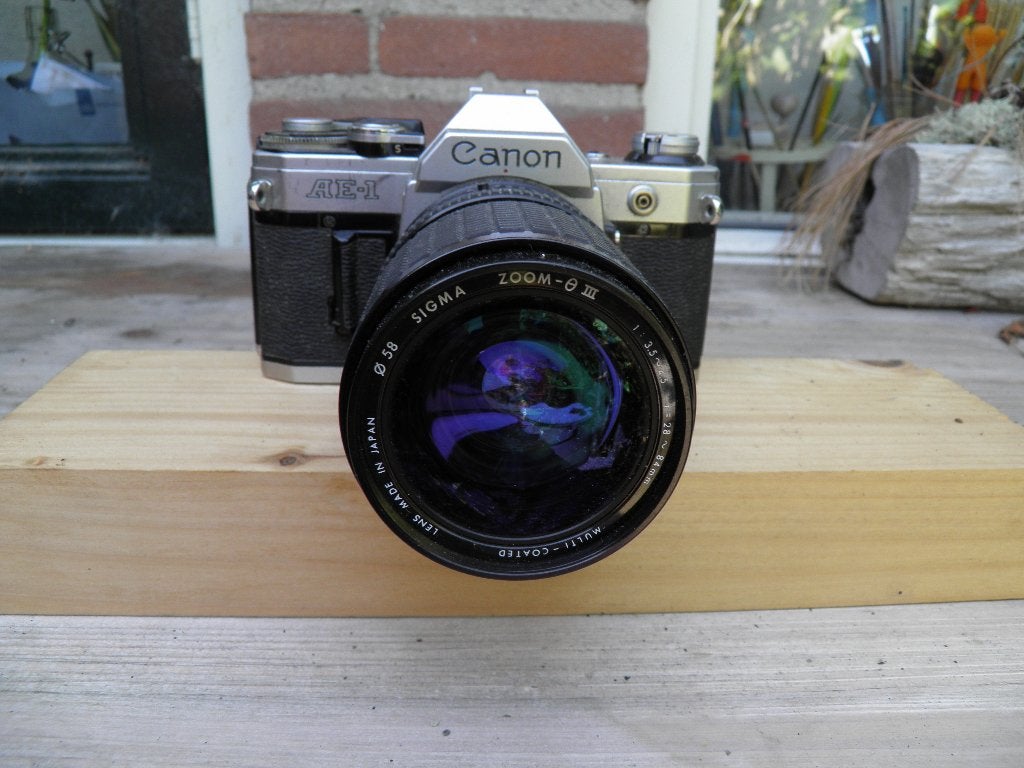 Canon ae1 met lange lens werkt, Ophalen of Verzenden, Zo goed als nieuw, Spiegelreflex, Canon