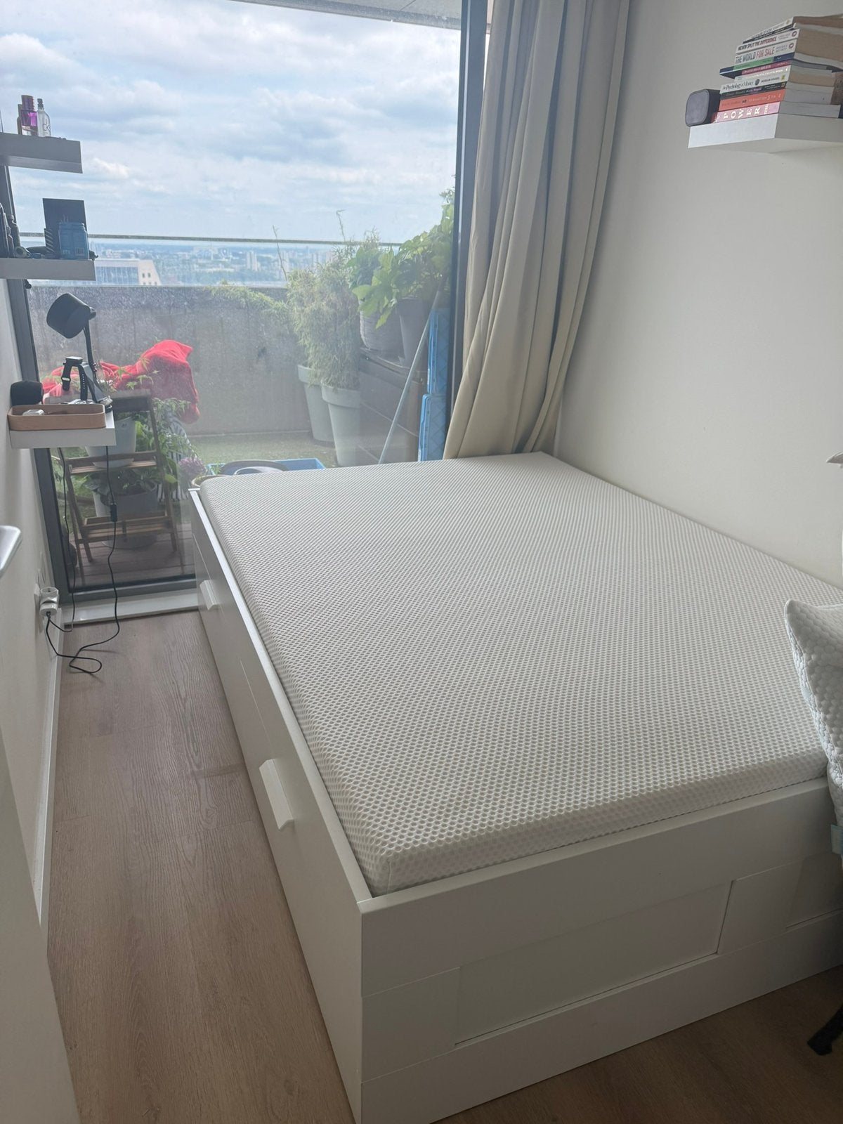 Double size bed and a wardrobe
