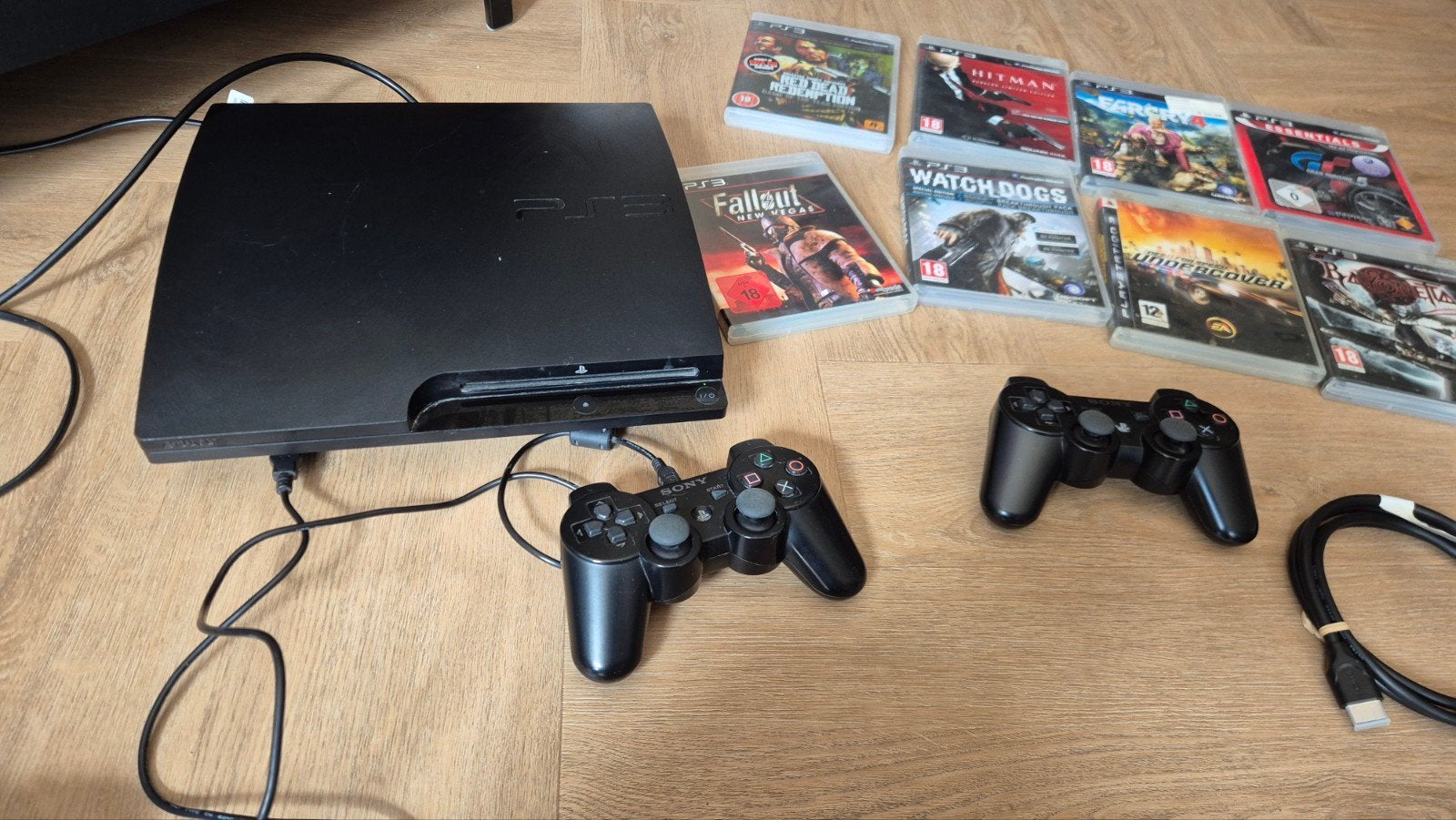 PS3 Slim met 2 controllers en 9 games, Spelcomputers en Games, Ophalen of Verzenden, Gebruikt, Avontuur en Actie, Eén computer