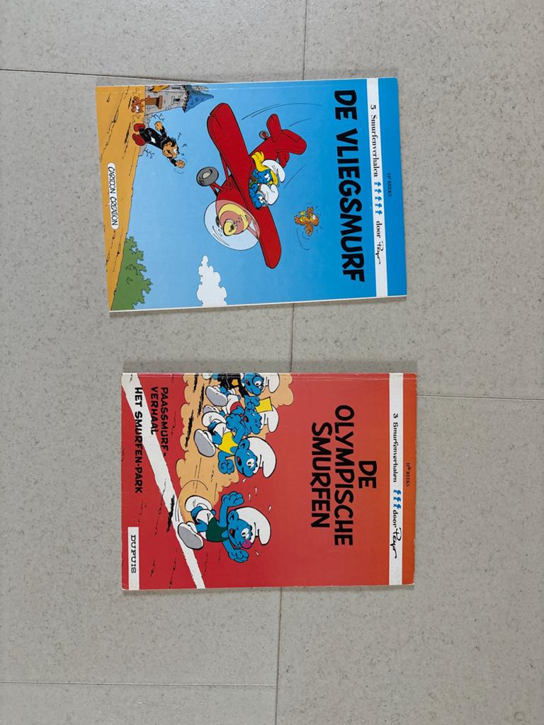 De Vliegsmurf & De Olympische Smurfen - 2 Smurfen stripboeke, Ophalen of Verzenden, Gelezen