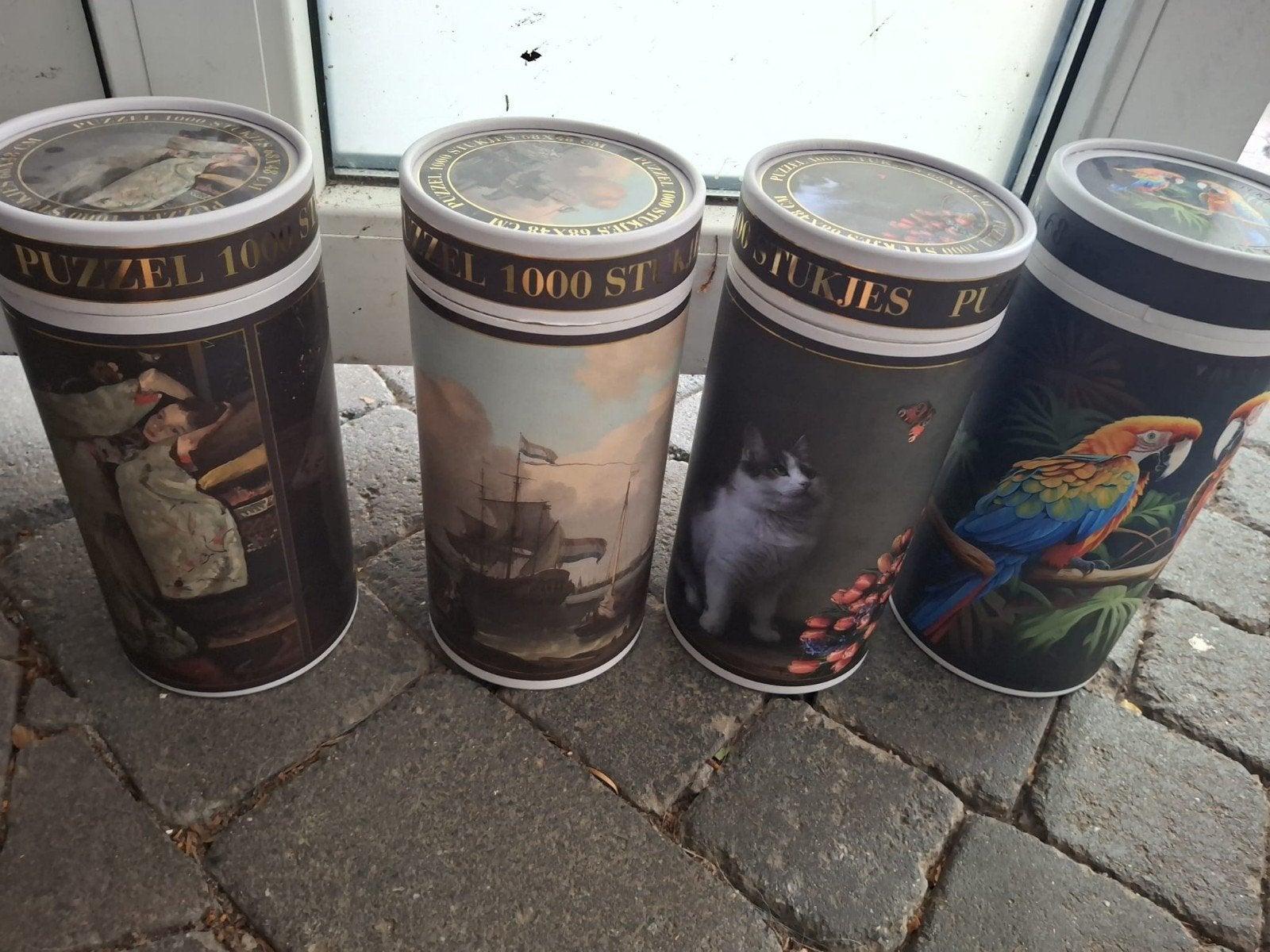 Set van 4 Legpuzzels 1000 Stukjes in Koker, Ophalen of Verzenden, 500 t/m 1500 stukjes, Gebruikt, Legpuzzel