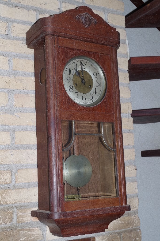 antieke wandklok, Ophalen