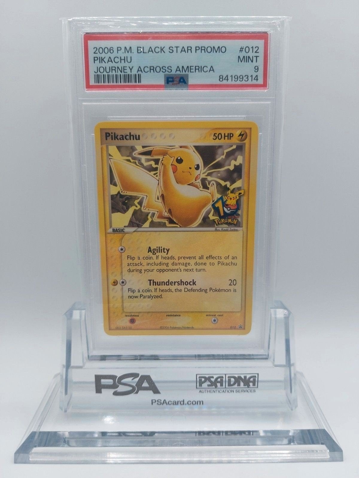 Pikachu 012 (10th anniversary) Journey Across America PSA 9, Ophalen of Verzenden, Zo goed als nieuw