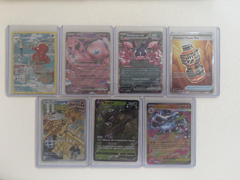 Verschillende Pokemon hitjes, Ophalen of Verzenden, Zo goed als nieuw, Meerdere kaarten, Foil