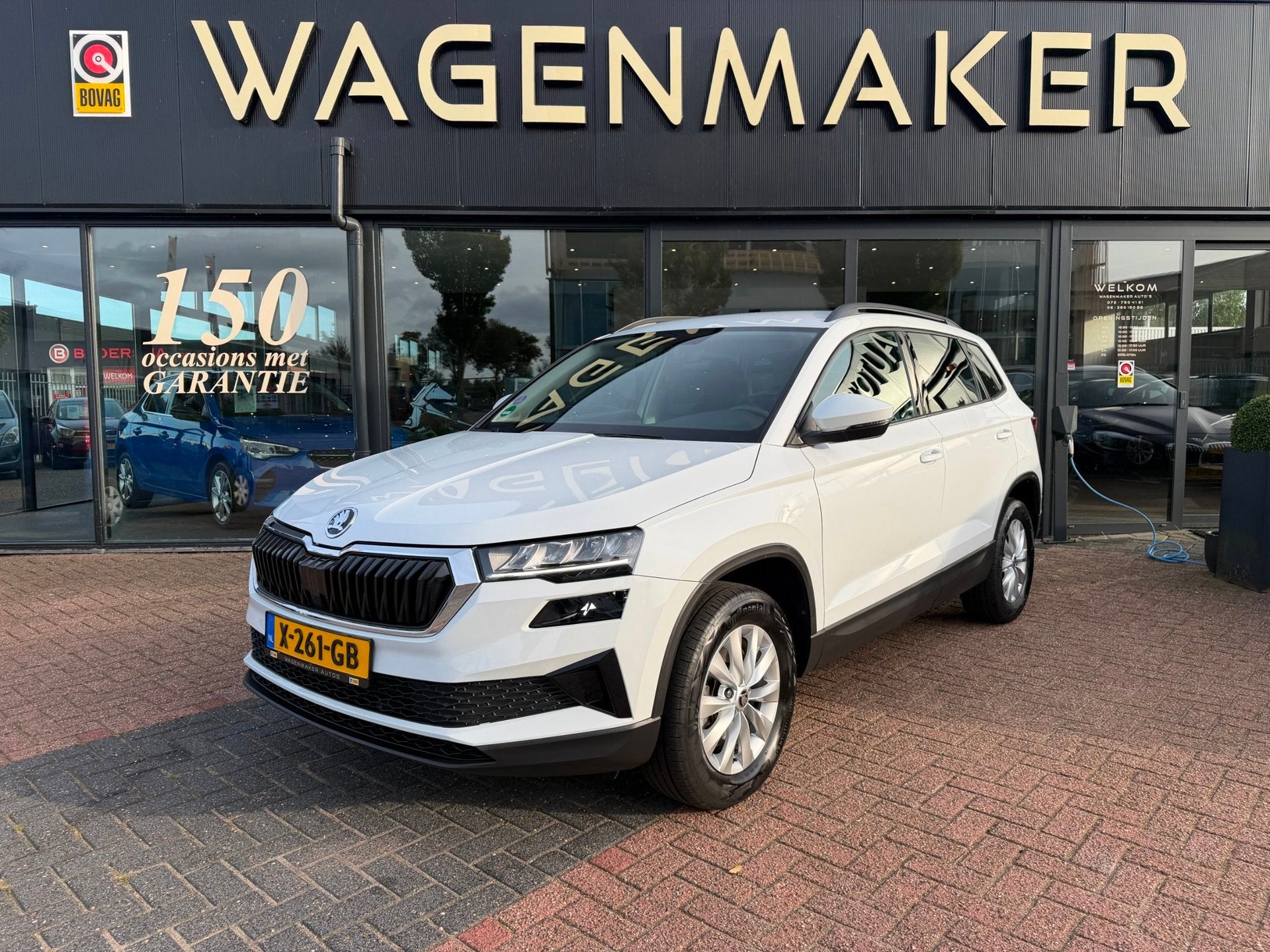 Skoda Karoq 1.5 TSI ACT Business Edition AUT|NAVI|Trekhaak!, Auto's, Stof, Euro 6, 4 cilinders, Wit