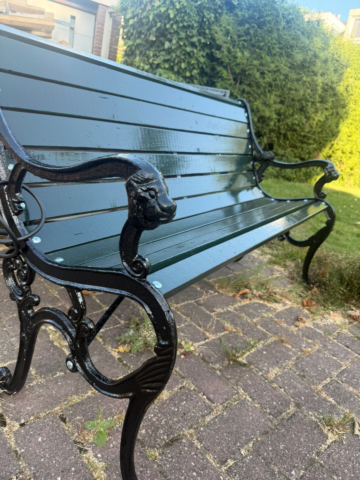 Leeuwkop gietijzeren tuinbank, Ophalen