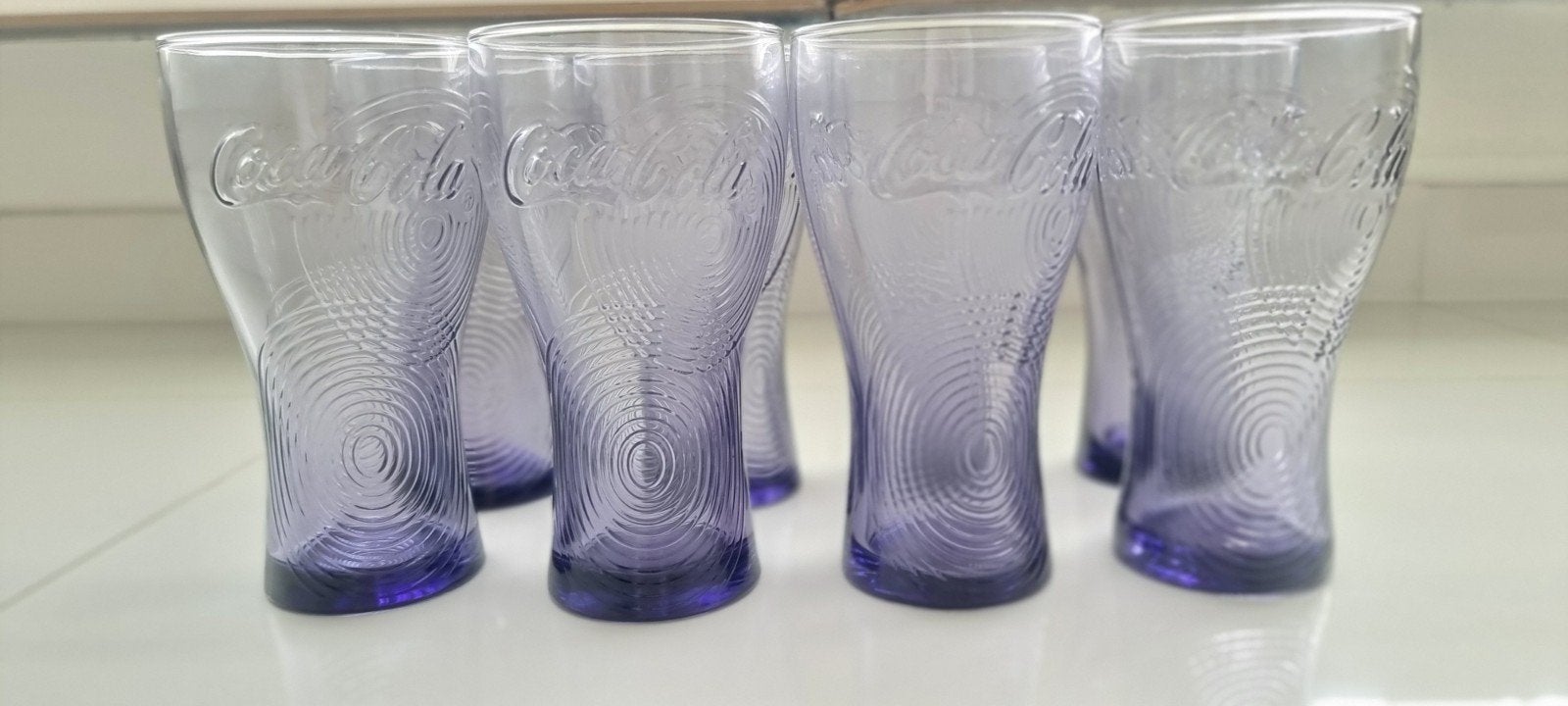 Nieuwe paarse Coca-Cola glazen (set van 8), Huis en Inrichting, Ophalen of Verzenden, Nieuw, Paars, Overige merken