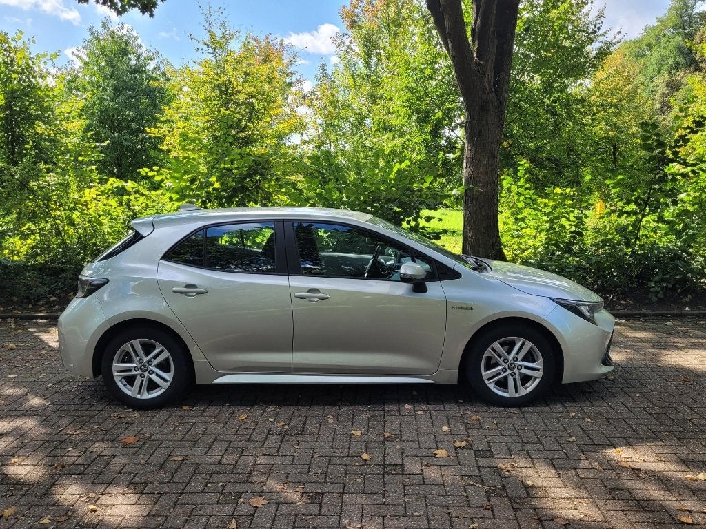 Toyota Corolla 1.8 Hybrid 122pk CVT 2019 Grijs, Auto's, Dealer onderhouden, 450 kg, 750 kg, Corolla