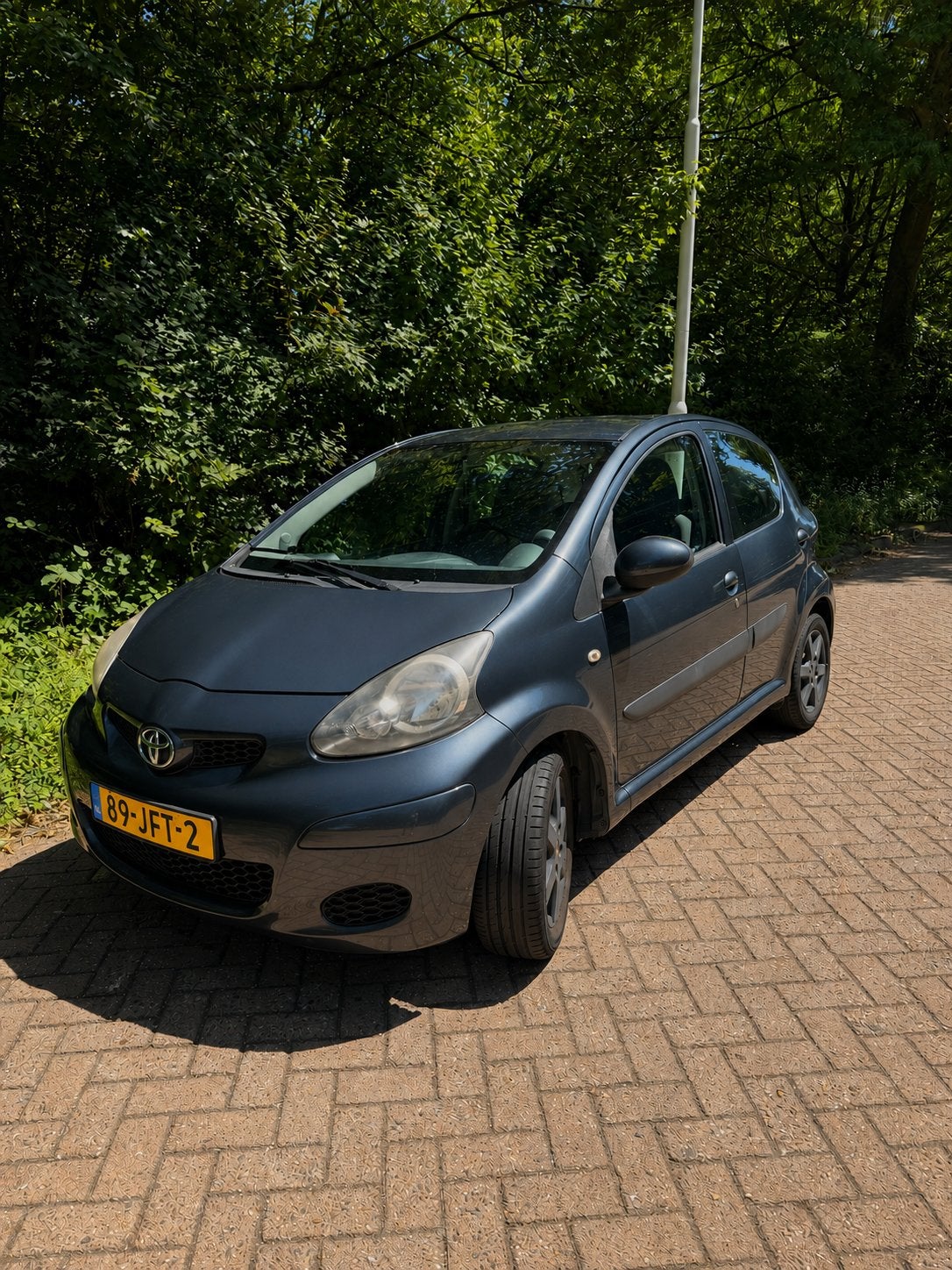 Toyota Aygo 1.0 12V Vvt-i 5DRS 2009 Grijs, Auto's, Voorwielaandrijving, 4 stoelen, 68 pk, Origineel Nederlands