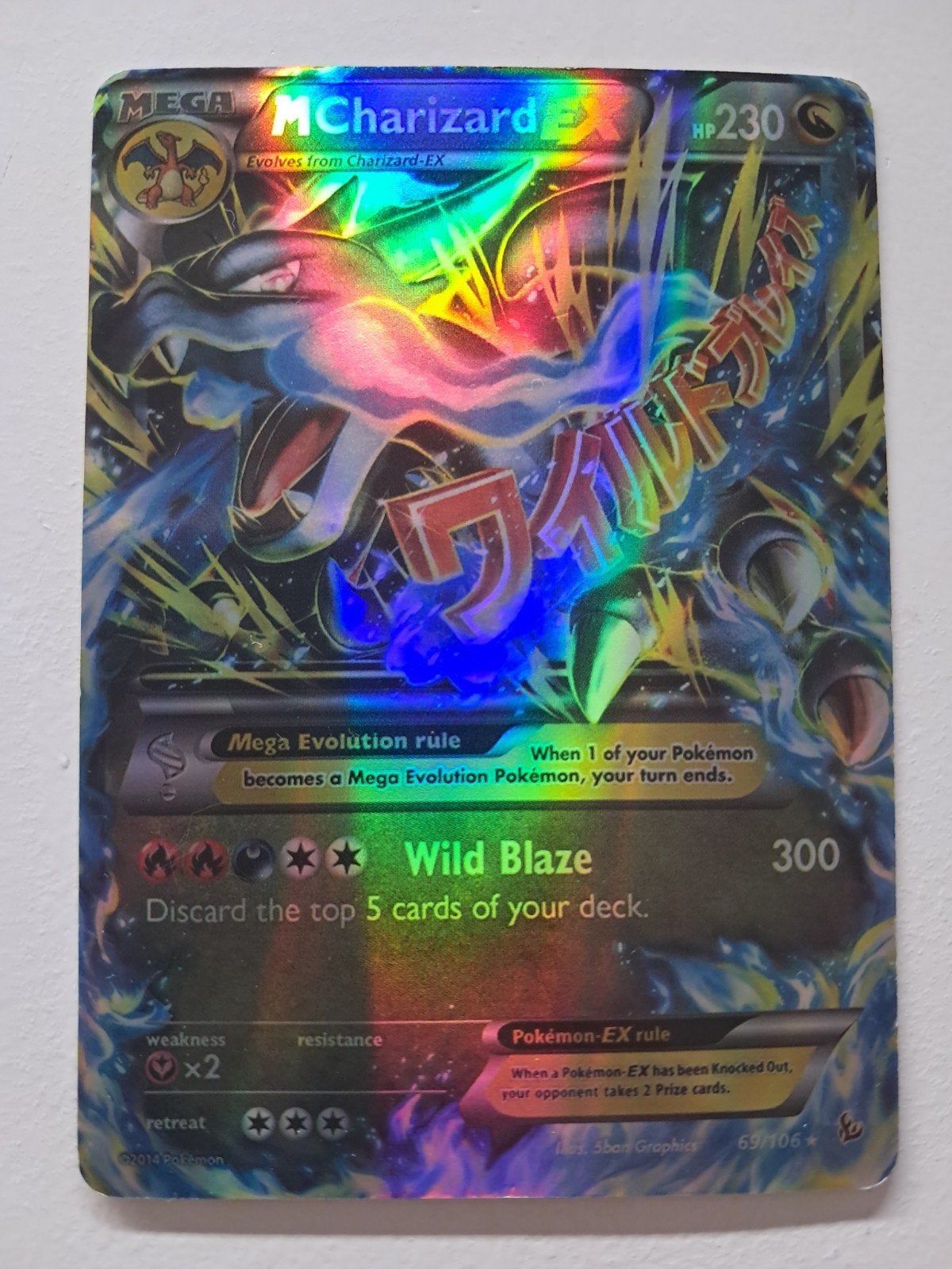 M Charizard EX Pokémon Kaart - Wild Blaze 69/106 Foil, Ophalen of Verzenden, Zo goed als nieuw, Losse kaart, Foil