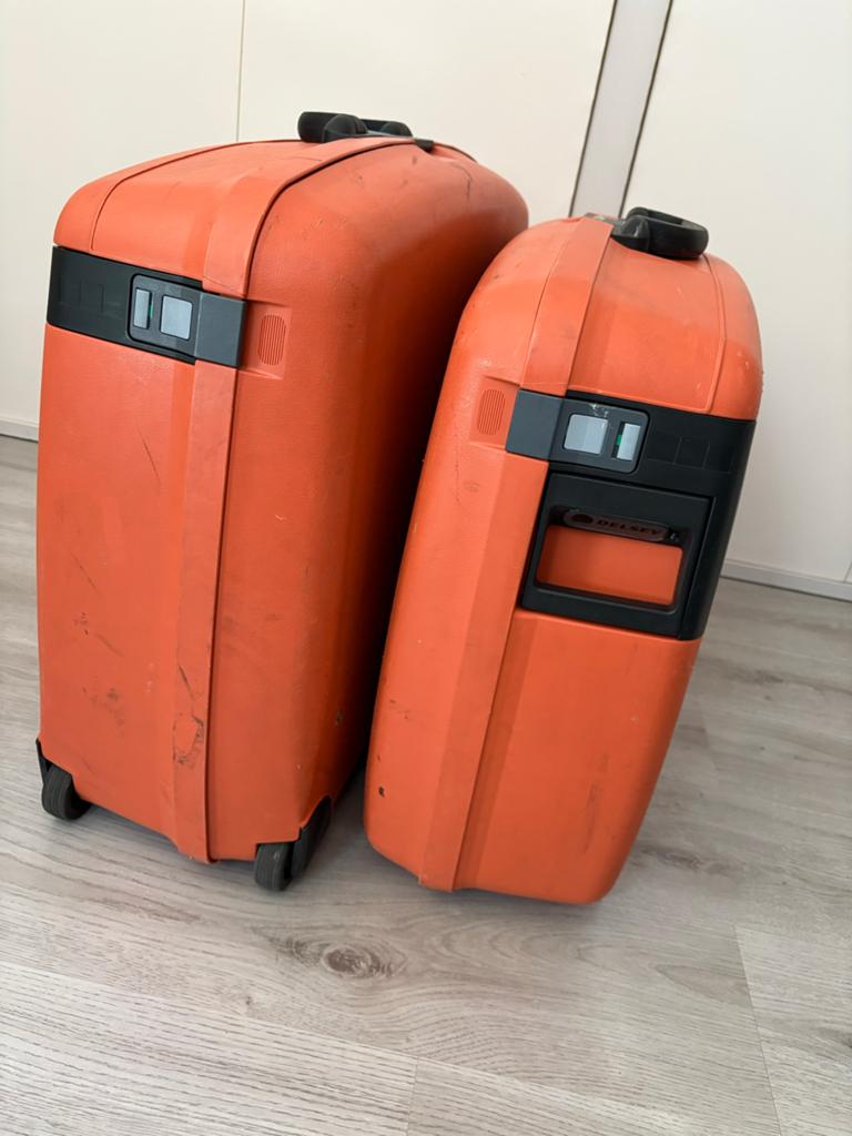 2 grote Delsey koffers - Oranje harde koffers, Sieraden, Tassen en Uiterlijk, Koffers, Gebruikt, Hard kunststof, 45 tot 55 cm