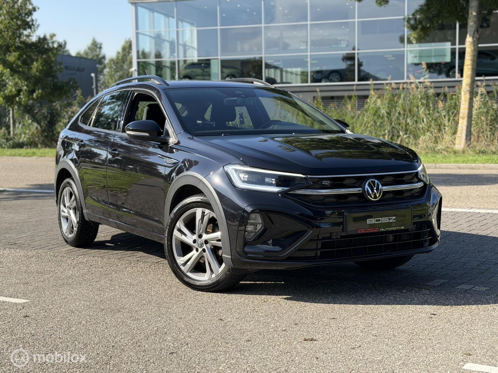 Volkswagen Taigo 1.0 TSI R-Line DSG CARPLAY IQ LANE SFEER, Auto's, Met garantie (alle), Alcantara, Zwart, Bedrijf