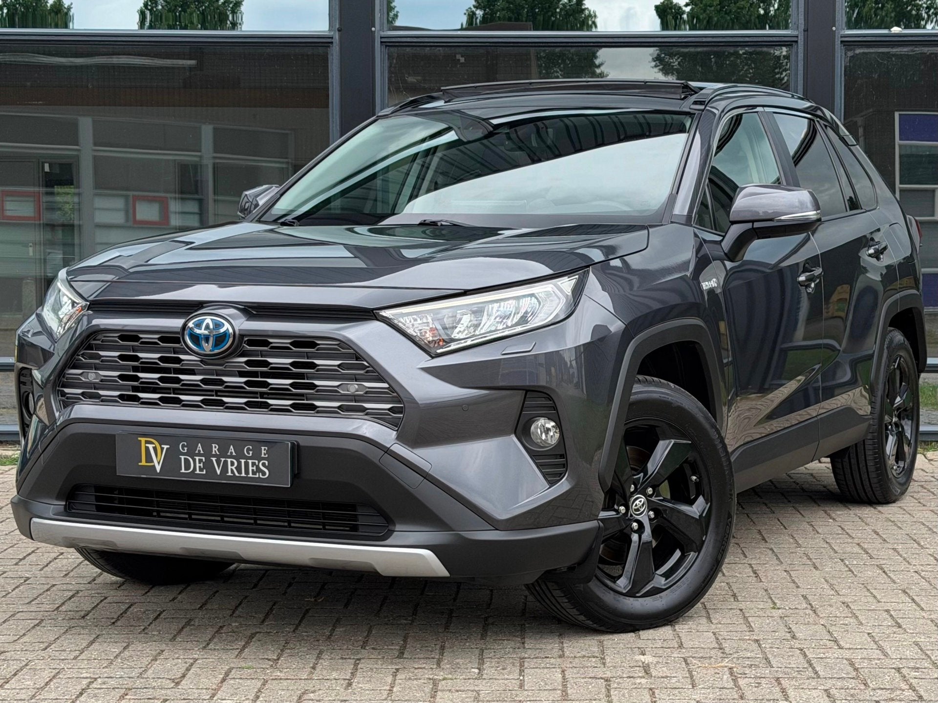 Toyota RAV4 2.5 Hybrid Executive ACC Panoramadak Trekhaak Ga, Auto's, Stof, Gebruikt, Zwart, 4 cilinders