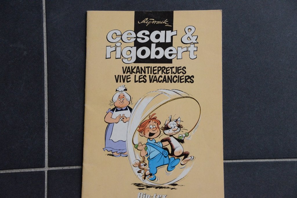Cesar & Rigobert. Vakantiepretjes - Vive les Vacances., Eén stripboek, Ophalen of Verzenden, Biotex