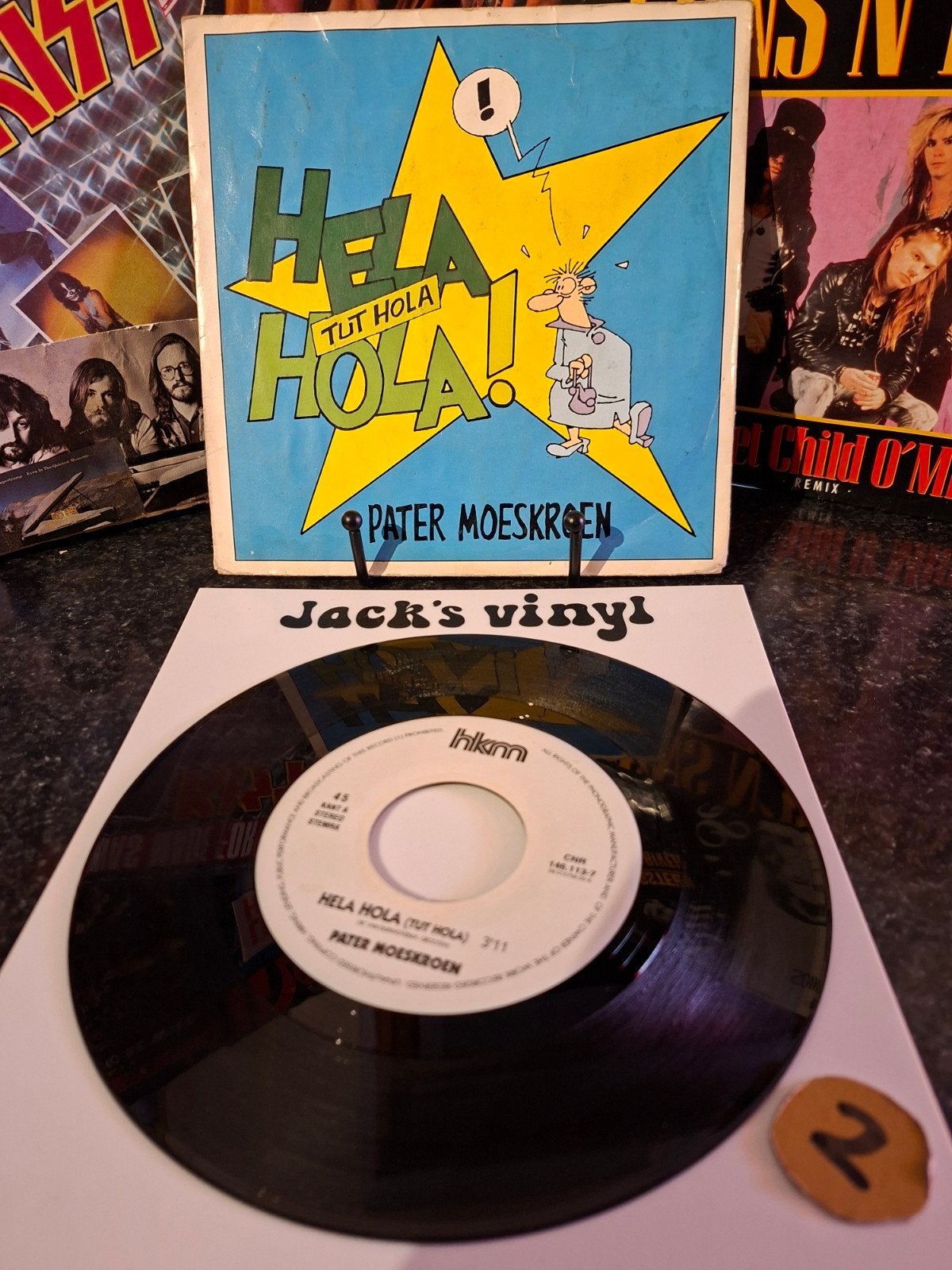 Pater Moeskroen - Hela Hola (Tut Hola) - 7 inch vinyl 1992/2, Ophalen of Verzenden, Gebruikt, 7 inch, Overige typen