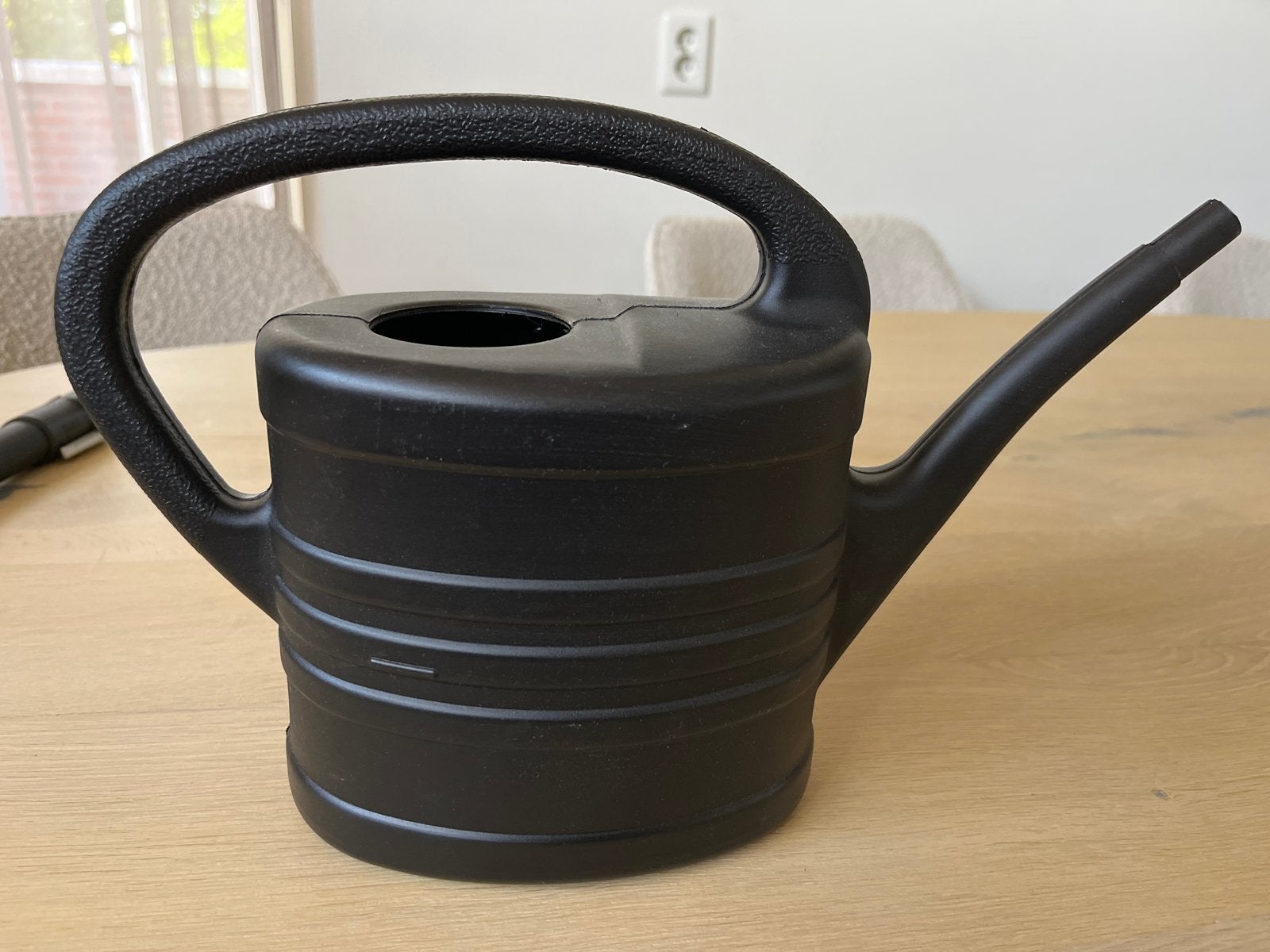 Gratis zwarte gieter van Megaplastic, Tuin en Terras, Gieters, Ophalen, Gebruikt, Kunststof