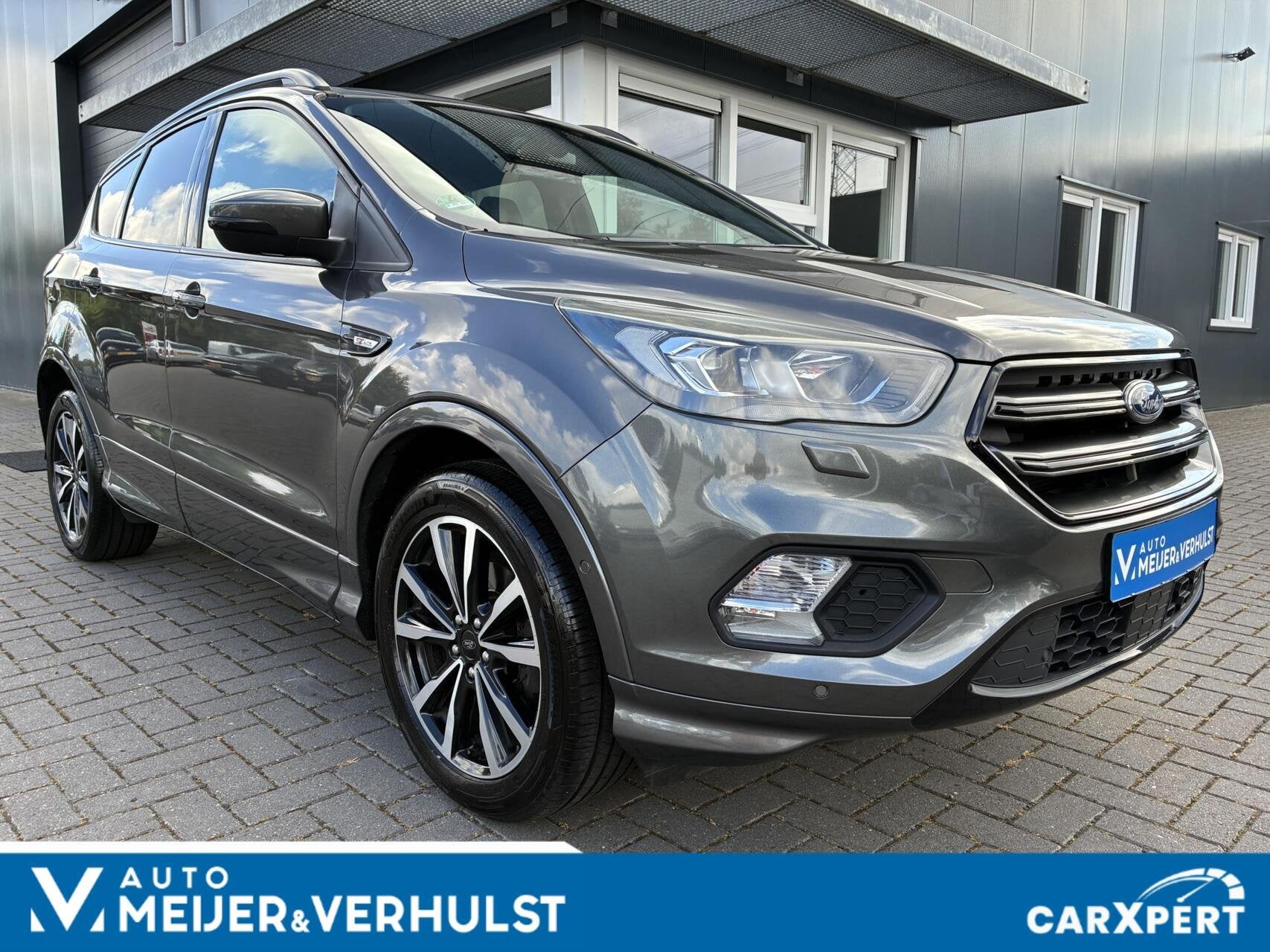 Ford Kuga 1.5 EcoBoost 150 PK ST-Line X | HALF-LEDER | NAVI, Auto's, Zwart, 4 cilinders, Leder en Stof, Bedrijf