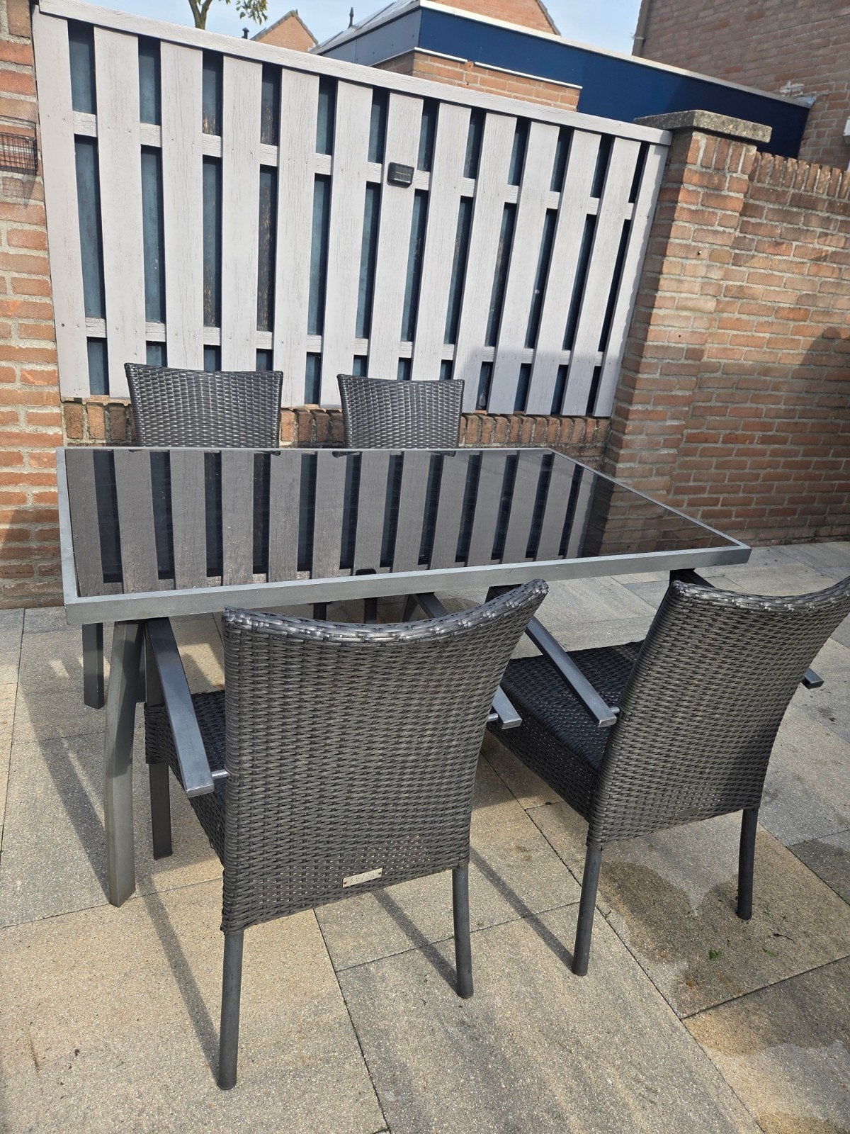 Tuinset met 4 stoelen en glazen tafel