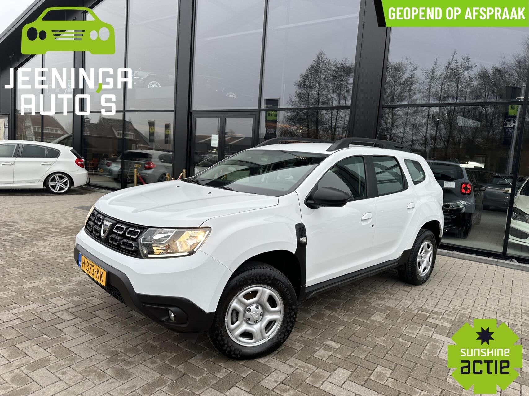 Dacia Duster TCe 100 Comfort|Airco|Cruise, Auto's, Gebruikt, 4 cilinders, Duster, Wit