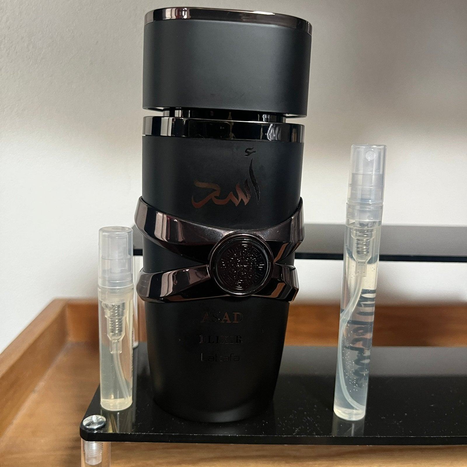 Lattafa - Asad Elixir samples 1-10ml, Ophalen of Verzenden, Zo goed als nieuw