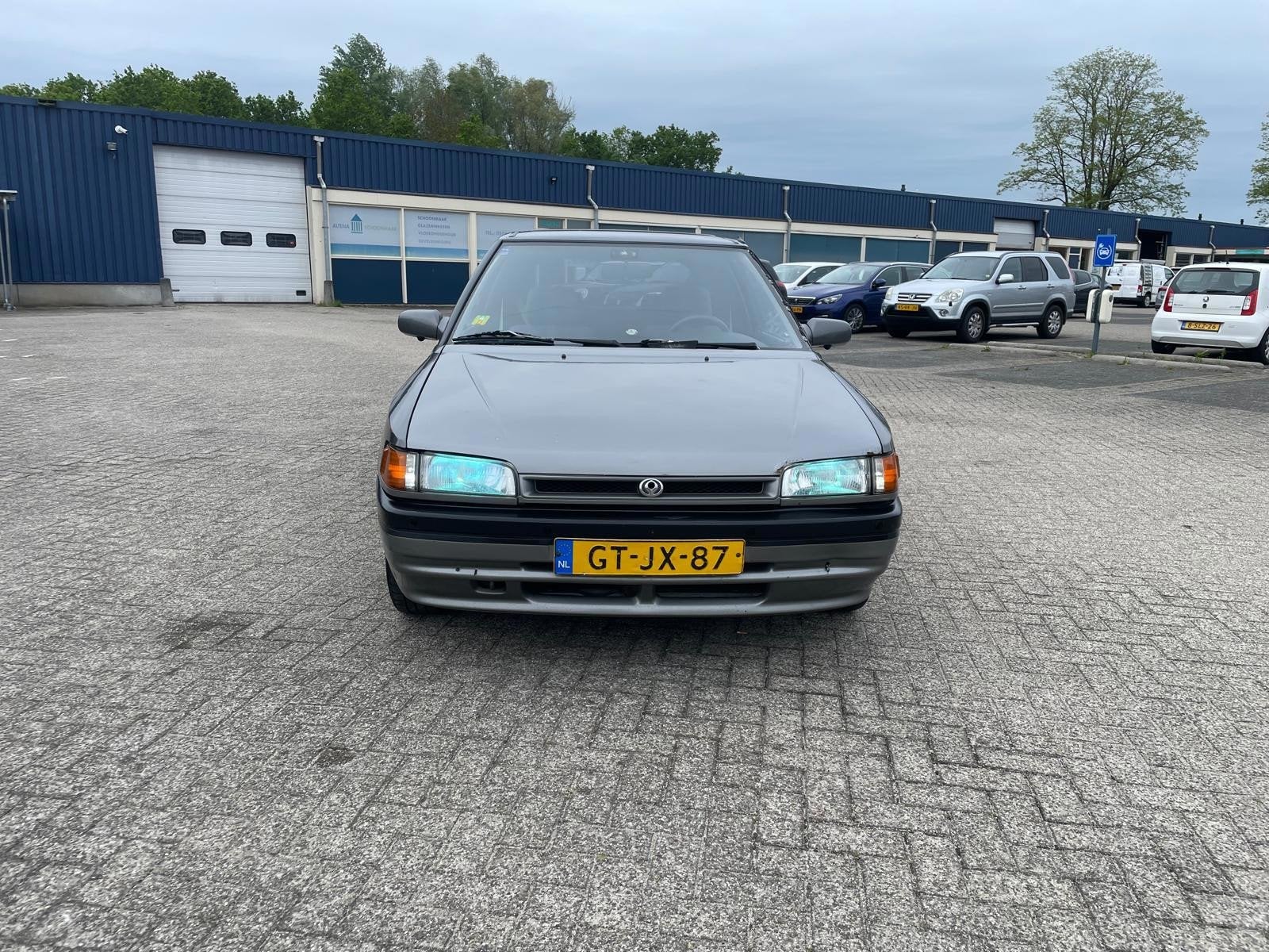 Mazda 323 1.3i Altis, Gebruikt, 31 €/maand, 4 cilinders, Origineel Nederlands