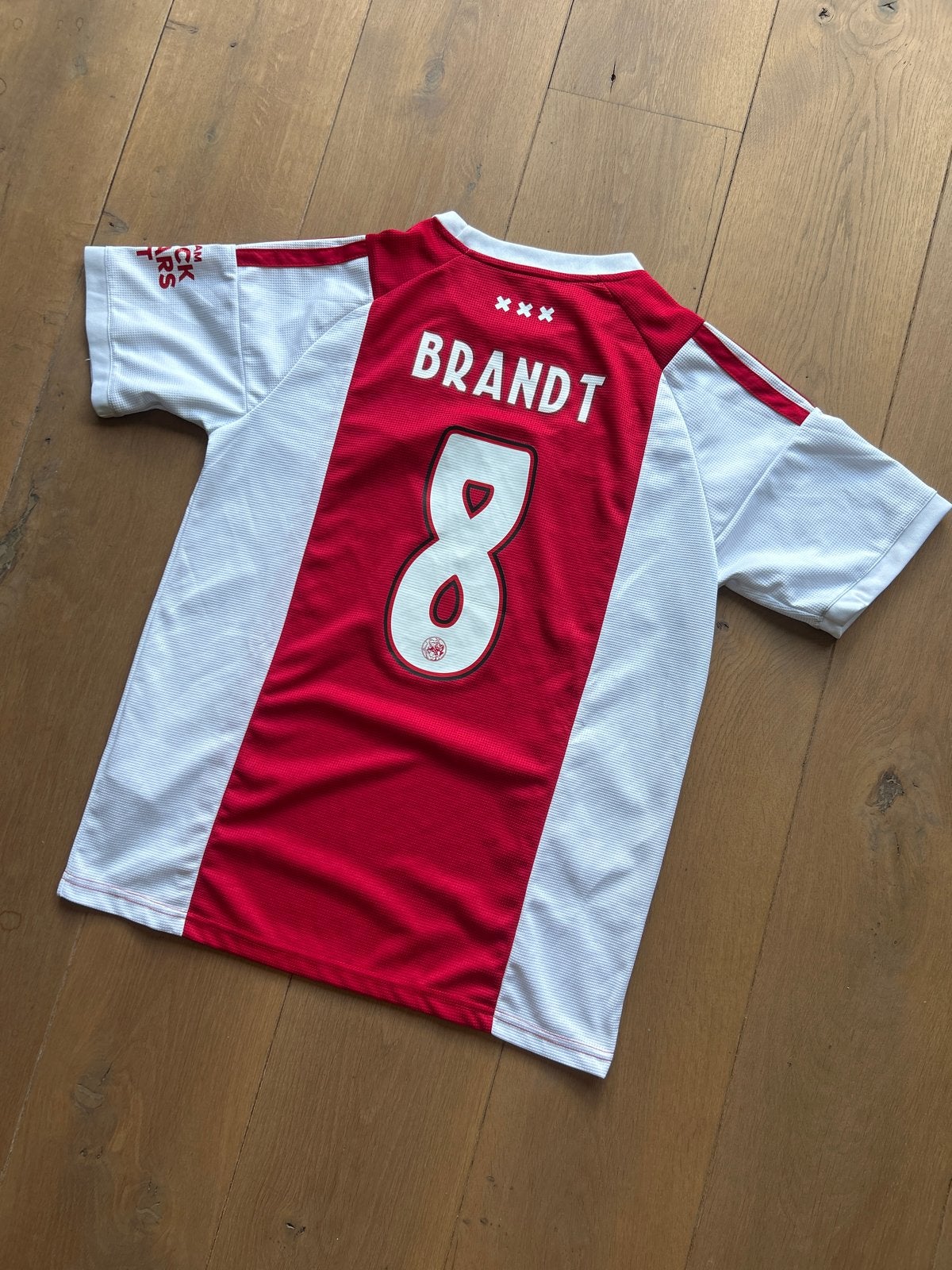 Ajax Thuisshirt Brandt #8 Maat L Seizoen 2026/2027, Maat 52/54 (L), Ophalen of Verzenden, Zo goed als nieuw, Rood