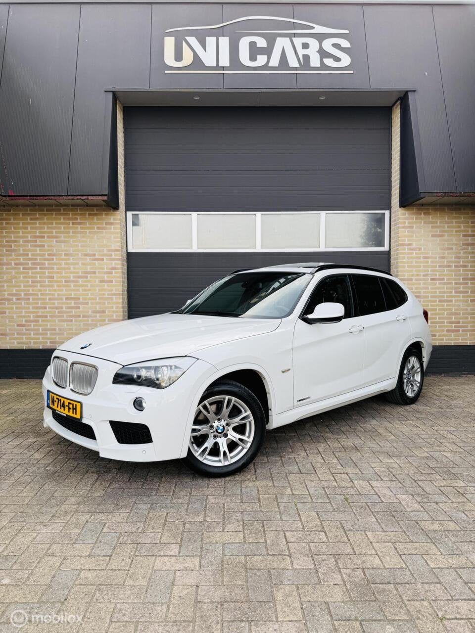 BMW X1 xDrive28i 245PK High Executive|M Sport||Alcantara|Dak, Auto's, Euro 5, Gebruikt, 4 cilinders, 2000 kg