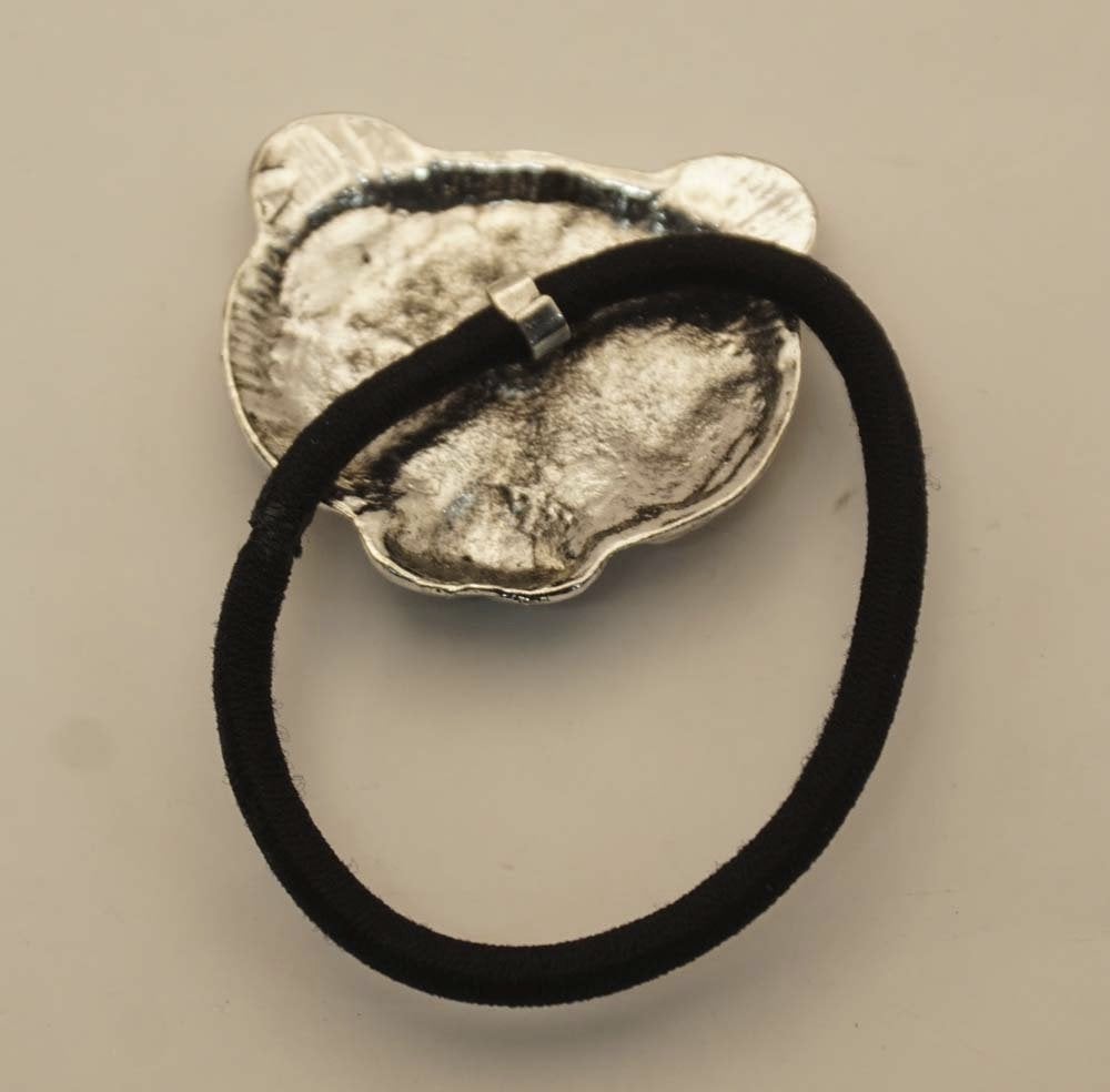 Haarelastiek met metalen bedel berenkop in de kleur nikkel, Importeur :  Riemen bretels, Marktplaats@riemen-bretels.nl, Haarspeld