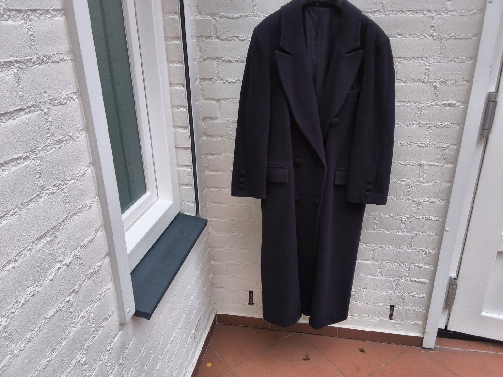 Donkerblauwe lange wollen jas mt 42 in goede staat, Ophalen of Verzenden, Zo goed als nieuw, Maat 42/44 (L), Blauw