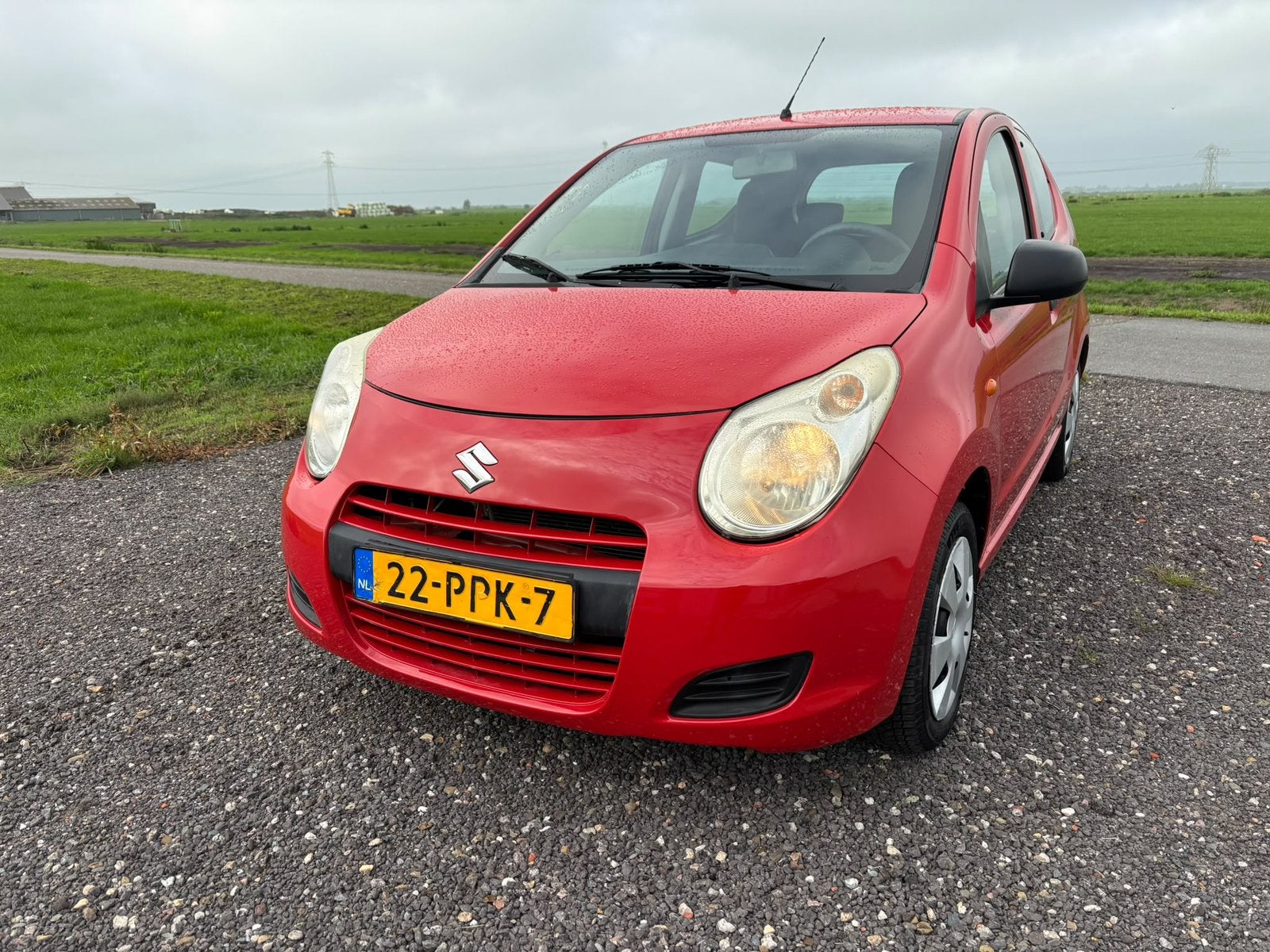 Suzuki Alto 1.0 2011 Rood, Auto's, Voorwielaandrijving, Stof, 4 stoelen, Origineel Nederlands