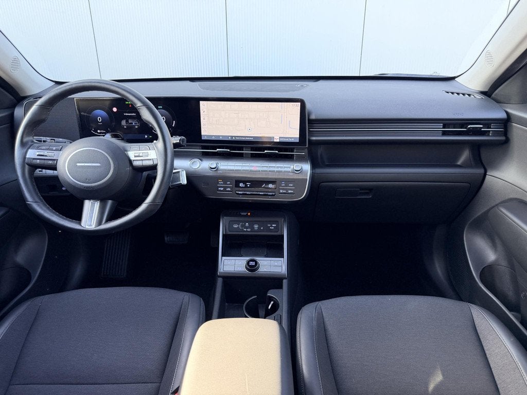 Hyundai Kona 1.6 GDI HEV Comfort Smart / Fabrieksgarantie to, Auto's, Hyundai, Stof, Gebruikt, Euro 6, Blauw